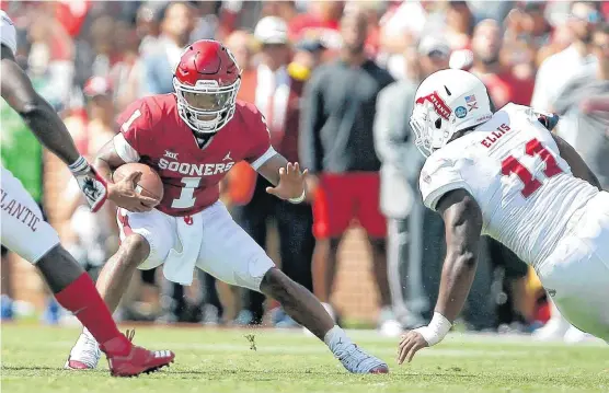  ?? [PHOTO BY BRYAN TERRY, THE OKLAHOMAN] ?? Oklahoma’s Kyler Murray (1) scrambles around Ray Ellis (11) and seemingly the entire Florida Atlantic defense in a 63-14 win on Sept. 1.