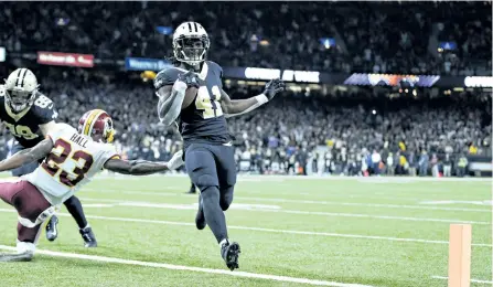  ?? WESLEY HITT/ GETTY IMAGES ?? New Orleans Saints’ running back Alvin Kamara runs the ball in for a touchdown during against the Washington Redskins at Mercedes-Benz Superdome, in New Orleans, Louisiana. The Saints defeated the Redskins 34-31.