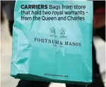  ?? ?? CARRIERS Bags from store that hold two royal warrants – from the Queen and Charles