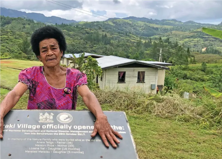  ?? Photo: Josefa Babitu ?? Losena Nai in front of the tombstone at Tukuraki Village, Ba, where her son and his family’s names are printed.