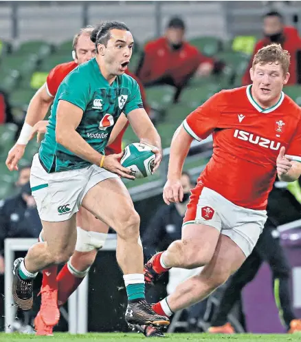  ??  ?? Good shout: Ireland wing James Lowe, who scored with the final play of the game, takes on the Welsh defence last night