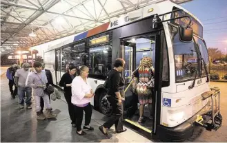  ?? Cody Duty / Houston Chronicle ?? Riders board the bus Thursday at the Hillcroft Park & Ride on the new Route 151, one of the routes that has drawn the most criticism from riders since the changes to bus service in August.