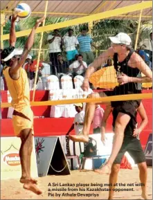  ??  ?? A Sri Lankan player being met at the net with a missile from his Kazakhstan opponent. Pic by Athula Devapriya