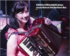  ??  ?? Eibhlín ní Bhaoighill plays accordion at the Harbour Bar.