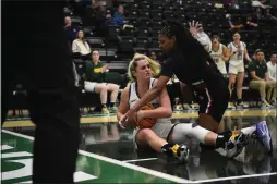  ?? ELLIOTT PORTILLO — CAL POLY HUMBOLDT ?? Humboldt’s Madison Parry battles with East Bay’s Jaela Richardson for a loose ball as the ‘Jacks lost 90-68to the Pioneers on Thursday.