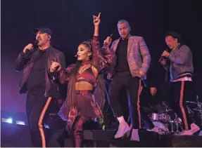  ?? KEVIN MAZUR/GETTY IMAGES FOR AG ?? Ariana Grande, with *NSYNC’s Joey Fatone, Lance Bass and JC Chasez, turns up the excitement for the Coachella crowd Sunday.