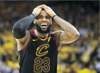  ?? EZRA SHAW/GETTY IMAGES ?? LeBron James saw a potential win turn into an overtime loss Thursday during Game 1 of the NBA final as Cleveland teammate JR Smith passed up a shot at the buzzer in a 124-114 Golden State win.