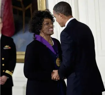  ??  ?? Life at the top: Jessye Norman receives the National Medal of the Arts from President Barack Obama in 2010; (below) her fellow singer Damon Evans as Sportin’ Life in the Glyndebour­ne production of Gershwin’s Porgy and Bess, 1987