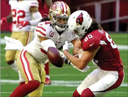  ?? RICK SCUTERI — THE ASSOCIATED PRESS ?? San Francisco 49ers middle linebacker Fred Warner breaks up a pass intended for Cardinals tight end Dan Arnold (85) during the first half on Saturday in Glendale, Ariz.