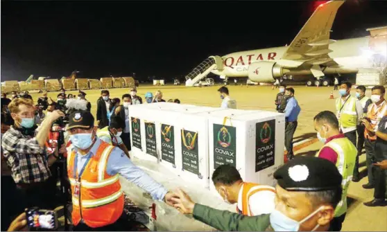  ?? HENG CHIVOAN ?? The first shipment of 324,000 doses of the AstraZenec­a/SII Covid-19 vaccine is delivered to Phnom Penh Internatio­nal Airport on Tuesday.