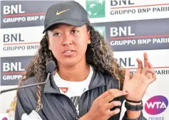  ?? — AFP photo ?? Japanese tennis player Naomi Osaka shows her hand as she gives a press conference to announce that she has withdrawn from her WTA Masters tournament tennis in Rome.
