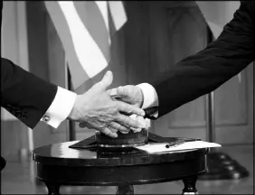  ?? DOUG MILLS / THE NEW YORK TIMES ?? Trump shakes hands with Russian President Vladimir Putin during their meeting Monday in Helsinki.