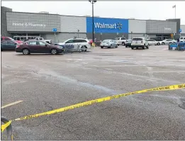  ?? ADRIAN SAINZ — THE ASSOCIATED PRESS ?? Police tape blocks off a Walmart store parking lot in Forrest City, Ark., on Monday.