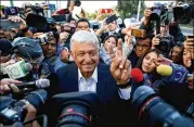  ?? GARY CORONADO / LOS ANGELES TIMES ?? Presidenti­al candidate Andrés Manuel López Obrador makes his way Sunday to a polling booth to cash his ballot in the Coyoacán section of Mexico City. He won the presidency decisively.