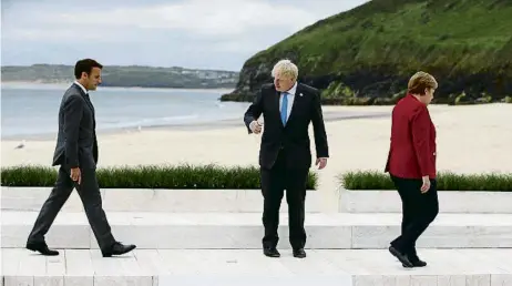  ?? HOLLIE ADAMS / BLOOMBERG ?? Emmanuel Macron, Boris Johnson i Angela Merkel a la cimera del G-7 de Carbis Bay al juny