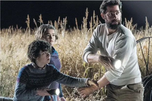  ?? — PARAMOUNT PICTURES ?? Noah Jupe, left, Millicent Simmonds and John Krasinski star in the surprise hit A Quiet Place, which writer, director and actor Krasinski views as a meditation on parenting.