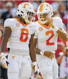  ?? STAFF FILE PHOTO BY C.B. SCHMELTER ?? Tennessee quarterbac­k Jarrett Guarantano (2) talks with running back Ty Chandler before a snap against Georgia earlier this year. Chandler said the Vols must pay attention to details in their last two regular-season games. They need one more victory to become eligible for a bowl bid.