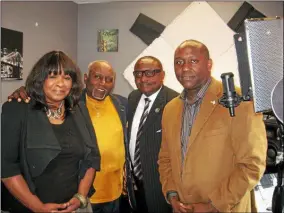  ?? THE MORNING JOURNAL FILE ?? Betty J. Halliburto­n, Clarence Ballard, Jerome Williams and Mark Ballard stand in one of the production studios at 1505Kansas Ave. developed for WNZN Power 89.1FM radio station in October 2014. Clarence Ballard died of COVID-19in early May at the age of 80, Mark Ballard said.