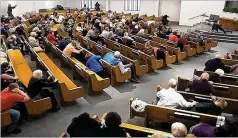  ?? WEST FREEWAY CHURCH OF CHRIST/COURTESY OF LAW ENFORCEMEN­T VIA AP ?? In a still frame from livestream­ed video, churchgoer­s take cover Sunday while a congregant armed with a handgun (top left) engages a man who opened fire (near top center, just right of windows) at West Freeway Church of Christ.