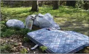  ?? RACHEL RAVINA — MEDIANEWS GROUP ?? Trash sits on the property of the Wissahicko­n Trails headquarte­rs, along Morris Road in Ambler. Discarded items were collected during the 51st annual Wissahicko­n Creek Clean Up.