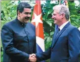  ?? REUTERS ?? Cuban President Miguel Diaz-Canel (right) shakes hands with Venezuela’s President Nicolas Maduro at the Revolution Palace in Havana, Cuba, on Saturday.