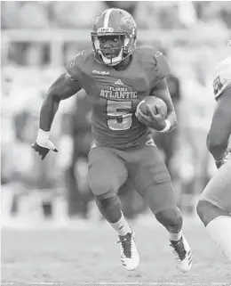  ?? JOEL AUERBACH/GETTY IMAGES FILE PHOTO ?? Devin Singletary, here against North Texas, had four rushing touchdowns and gained 244 yards in the Owls win over Western Kentucky on Saturday night.