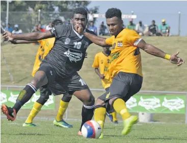  ?? Photo: Waisea Nasokia ?? Ba’s Malakai Tiwa defends against Tavua’s Atunaisa Livanalagi in their pool match at the Churchill Park in Lautoka on July 21, 2018.