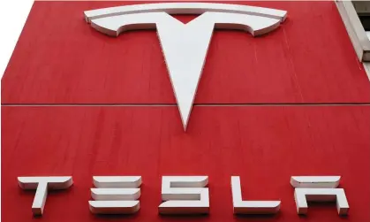  ?? Photograph: Arnd Wiegmann/Reuters ?? The free Tesla was offered as part of a New Zealand house sale in what is a stalling property market.