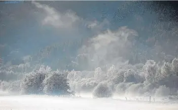  ?? Pictures: Kim Cessford/ PA. ?? Above: Mist rises from the River Tay in the winter sunshine near Kindallach­an on the A9;
Above right: Cross country runners set off through heavy snow around Peebles in the Borders;
Right: A remote bothy shelter above Kingussie in the Highlands.