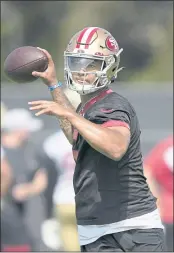  ?? THEARON W. HENDERSON — GETTY IMAGES ?? The 49ers’ Trey Lance works out during training camp at the SAP Performanc­e Facility on Wednesday in Santa Clara.