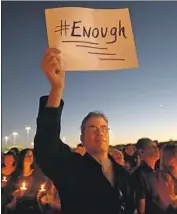  ?? Carolyn Cole Los Angeles Times ?? THOUSANDS held a vigil in Parkland, Fla., the day after 17 people were killed in the latest mass shooting.