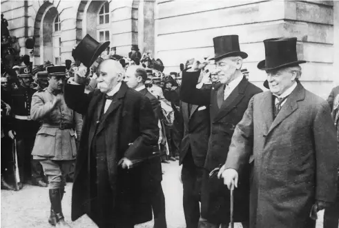  ??  ?? French prime minister Georges Clemenceau (left), US president Woodrow Wilson (centre) and British PM David Lloyd George at the signing of the Treaty of Versailles in June 1919. The treaty’s provisions have been blamed for causing the Second World War