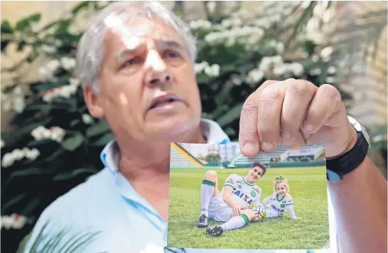  ?? Pictures / AP ?? Osmar Machado says his son, Chapecoens­e player Filipe Machado, pictured with his daughter Antonella, would be alive today if the team had flown with another airline.