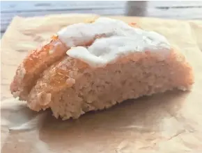  ?? MILWAUKEE JOURNAL SENTINEL ?? Mor Bakery &amp; Cafe makes a changing lineup of gluten-free sweets, such as this coconut cake with mango-orange topping. The owner has plans to make glutenfree bread and have cafe plates, such as soup and salad.
