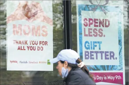  ?? THE ASSOCIATED PRESS ?? Signs about Mother’s Day are displayed May 8at a home decor department store in Northbrook, Ill.