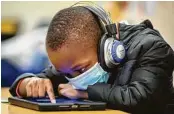  ?? Marie D. De Jesús / Staff photograph­er ?? Kindergart­ner Jeremiah Hopkins works on a tablet Thursday at Best Elementary in Alief ISD.