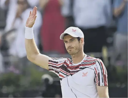  ??  ?? 0 Andy Murray, playing his first singles match on grass since 2018, celebrates winning his first round in the cinch Championsh­ips