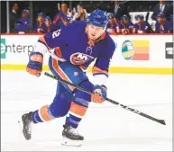  ?? Mike Stobe / NHLI via Getty Images ?? The Islanders’ Ross Johnston skates against the Flyers on April 3 in New York.