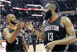  ?? [AP PHOTO] ?? Houston Rockets guard Chris Paul, left, and James Harden celebrate the team’s win over the Utah Jazz Tuesday in Houston.