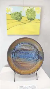  ??  ?? “Life Through the Desert” features a high fire stoneware platter by Mark Issenberg of Chattanoog­a and an oil on canvas by Jacques Sterenberg of Lehavot Haviva, Israel.