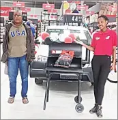  ?? ?? Albert Masilela poses with his braai stand and store assistant Thulisile.