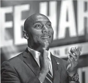  ??  ?? Lee Harris celebrates his win in the Shelby County mayor’s race Aug. 2 at One Commerce Square in downtown Memphis. Harris defeated Republican candidate David Lenoir. BRANDON DILL / FOR COMMERCIAL­APPEAL.COM