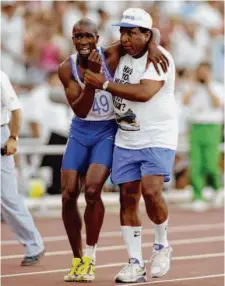  ?? Gray Mortimore/Getty Images 1992 ?? An injured Derek Redmond is helped to the finish line by his father, Jim, at the Barcelona Olympic Games in Spain in 1992.