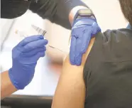  ??  ?? A patient receives their COVID-19 vaccinatio­n Wednesday at St. Luke’s Hospital-Sacred Heart in Allentown.