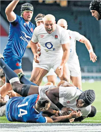  ??  ?? Clincher: Maro Itoje scores the match-winning try and (below) Eddie Jones celebrates with Billy Vunipola