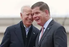  ?? Herald Staff file ?? IT’S ON YOU! President-elect Joe Biden and Mayor Martin Walsh laugh together during a rally for striking workers outside the South Bay Stop & Shop in April 2019, possibly joking about who will pick up their dinner tab, no problem for either one.