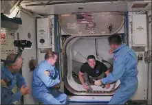  ?? NASA TV VIA REUTERS ?? NASA astronaut Bob Behnken arrives at the Internatio­nal Space Station aboard SpaceX’s Crew Dragon capsule in this image taken from video on Sunday.