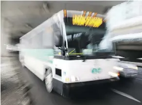  ?? PETER J. THOMPSON / NATIONAL POST ?? Passengers on-board a GO Transit bus were kept locked inside for25 minutes as police arrested a man and took him into custody.