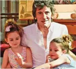  ??  ?? My girls: Proud dad Ronnie Wood with twins Alice and Gracie, four