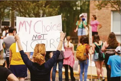  ?? Patrick Sikes / For Hearst Connecticu­t Media ?? Three Darien High School seniors organized a march on Saturday in town to support abortion rights.